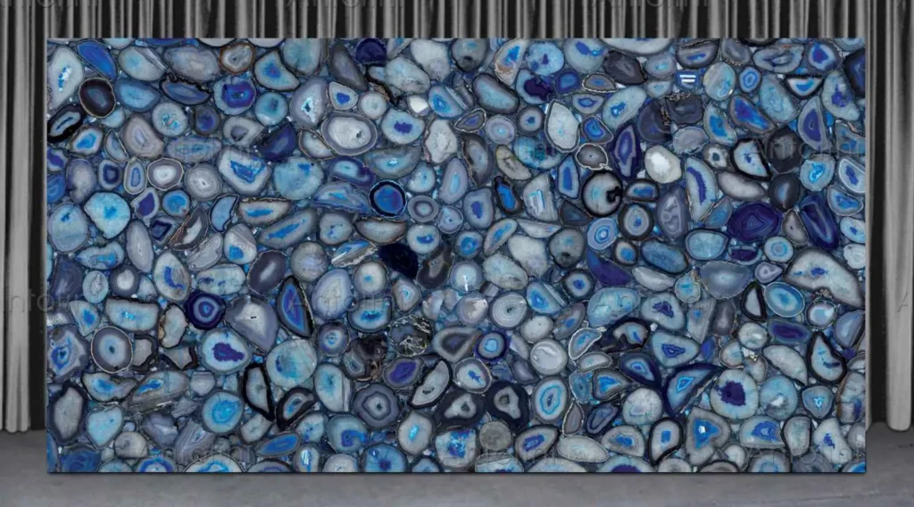 Antolini Blue Agate semi-precious stone slab featuring deep blue and violet circular patterns, ideal for backlit luxury feature walls.