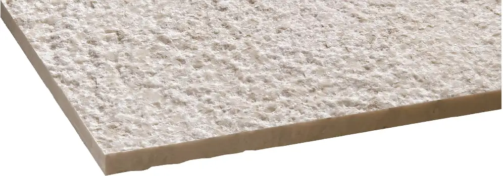 Bush-hammered stone finish showing a heavily textured natural stone surface with uniform impact marks for high slip resistance.