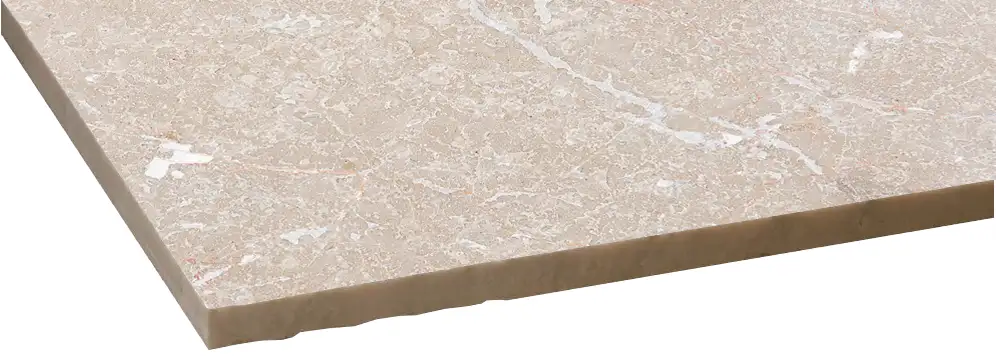 Flamed stone finish displaying a rough natural stone surface created by thermal treatment for enhanced slip resistance.