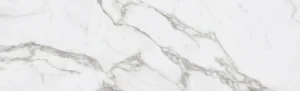 Close-up texture of Italian Calacatta Marble with honed finish. Displays characteristic V4 high variation with thick grey and gold veining on a warm white background.