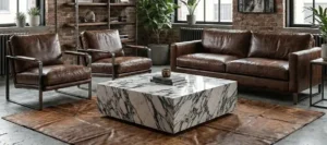 Calacatta Viola marble plinth coffee table used as a sculptural centerpiece in an industrial loft living room